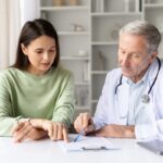 Patient and doctor reviewing a functional medicine treatment plan during a consultation