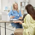 Woman discussing hormone replacement therapy options with her doctor during a consultation