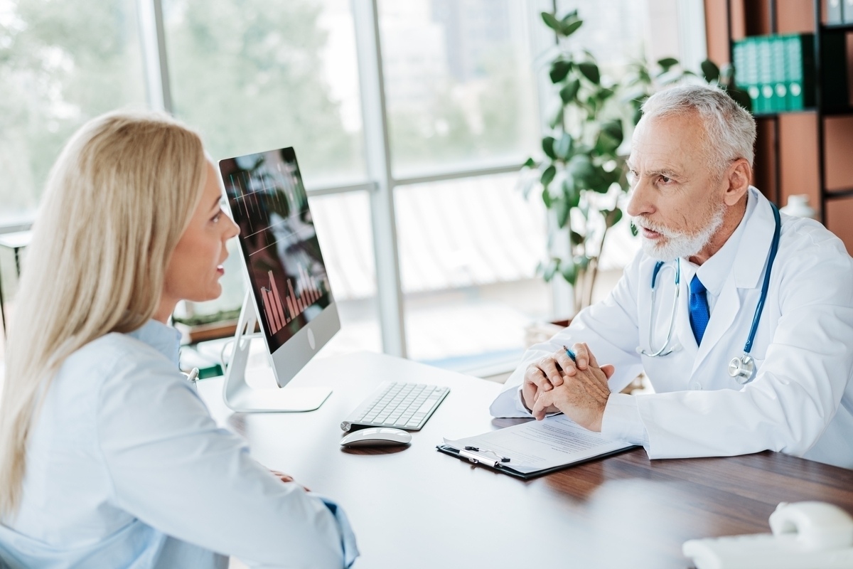 experienced physician discussing diagnostic findings with a patient during a functional medicine in Colleyville TX consultation