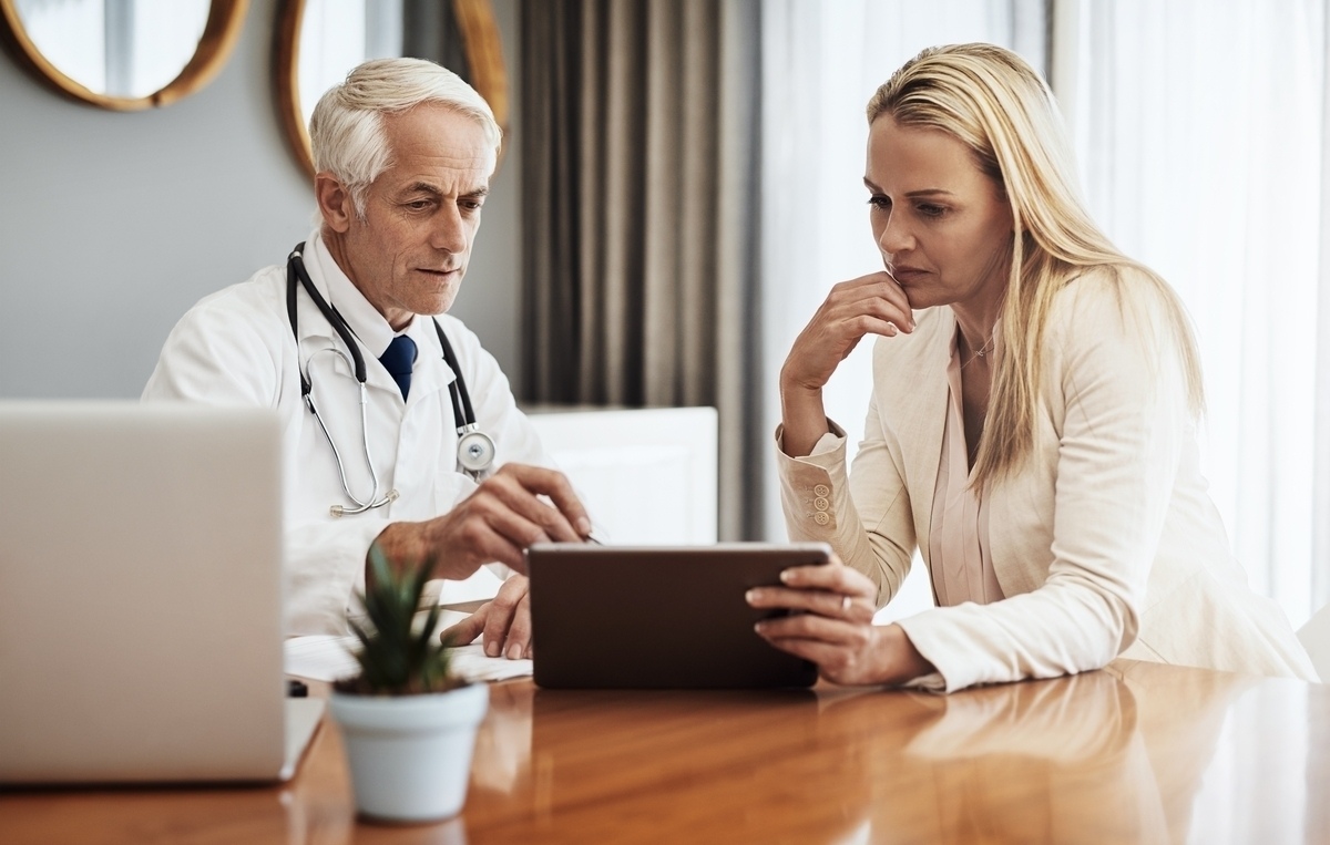 physician reviewing test results with a female patient during a functional medicine in Southlake TX consultation