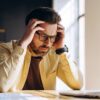 low testosterone and mental health effects shown by man struggling with concentration and mental fatigue at Apostol Integrative and Functional Medicine
