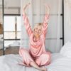 how long does HRT take woman waking up rested and energized representing hormone replacement therapy results at Apostol Integrative and Functional Medicine