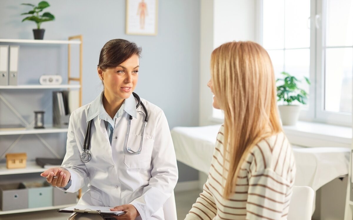 bioidentical hormone therapy doctor explaining treatment options to female patient at Apostol Integrative and Functional Medicine