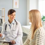 bioidentical hormone therapy doctor explaining treatment options to female patient at Apostol Integrative and Functional Medicine