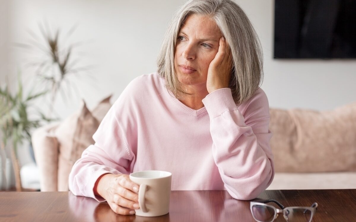 estrogen decline symptoms woman experiencing fatigue and mood changes at Apostol Integrative and Functional Medicine