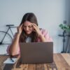 functional medicine for anxiety woman experiencing stress and tension at desk at Apostol Integrative and Functional Medicine