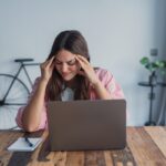 functional medicine for anxiety woman experiencing stress and tension at desk at Apostol Integrative and Functional Medicine