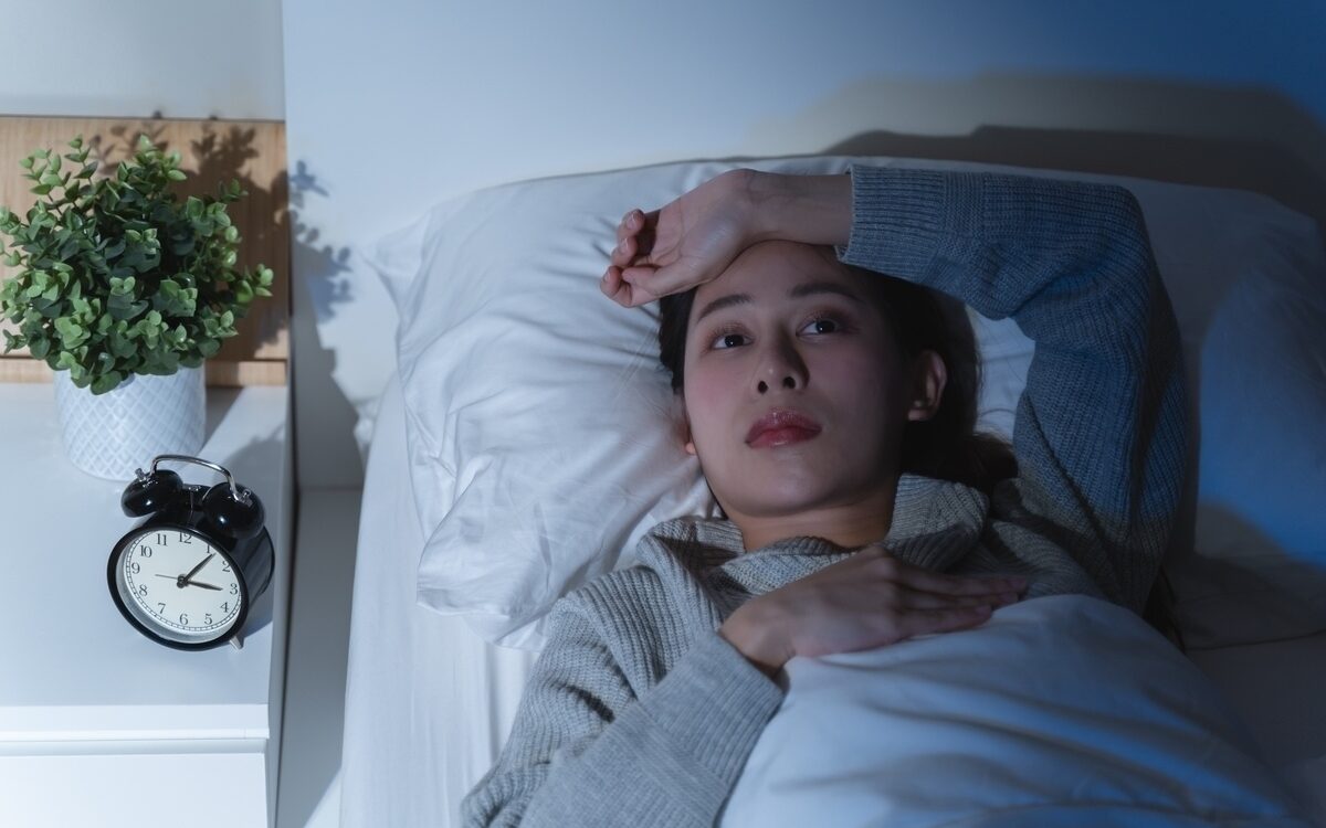 functional medicine for sleep woman lying awake at 3am unable to sleep at Apostol Integrative and Functional Medicine